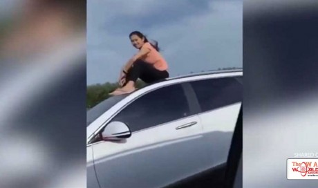  Woman Spotted Riding On Top Of Moving Car, Footage Goes Viral