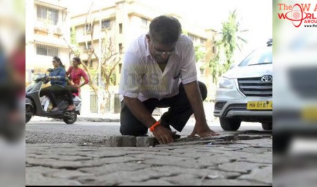 Indian father fills 556 potholes after his son dies in accident