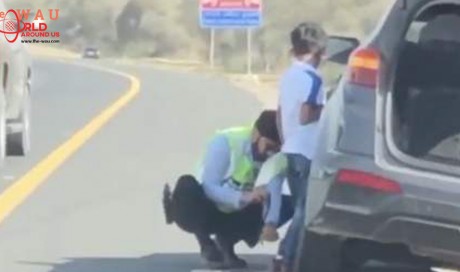 Video: UAE police officer goes viral for changing tyre of stranded SUV