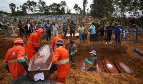 Amazon city resorts to mass graves as Brazil COVID-19 deaths soar