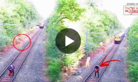 UNBELIEVABLE! Rail Worker Risks His Life To Save A Drunken Cyclist From Oncoming Train! WATCH HERE! | Blog | Life | WAU