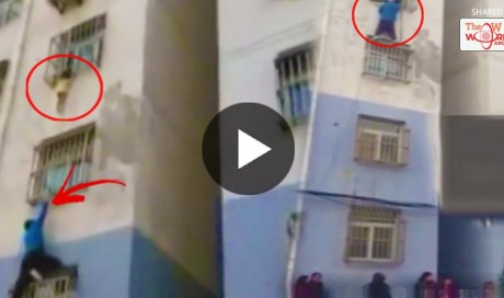 WATCH: Chinese Man Scaled A Building With His Bare Hands To Save A Boy Hanging From A Window! Incredible!