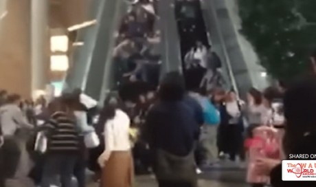 China: Crowded escalator going up suddenly shifts direction, throwing people downward!