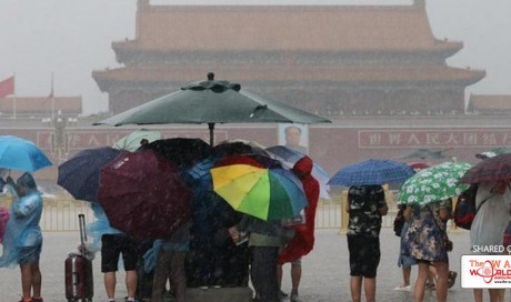 More than 1,500 flights cancelled at Beijing international airport as China warned of flash floods
