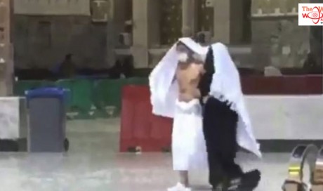 In a viral video, man shelters wife during heavy rainfall in Makkah
