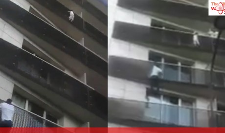 Hero climbs up outside of Paris building to save child dangling from balcony
