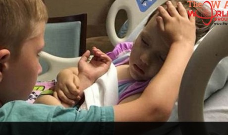 Photo of boy, 6, comforting sister dying of rare brain cancer goes viral
