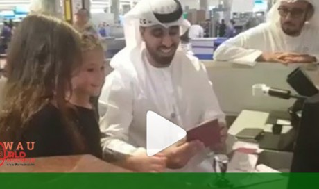 Video: Two children go behind Dubai immigration desk, stamp their own passports
