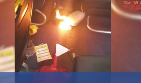 Ryanair passengers filmed fleeing plane after cell phone bursts into flames