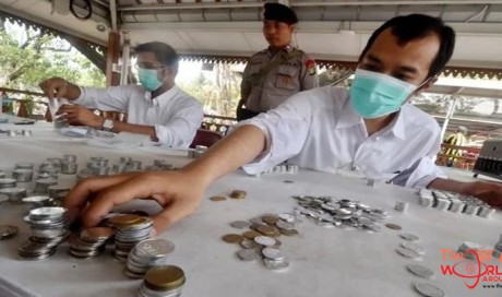 Indonesian man pays $10,000 to ex-wife ... in coins