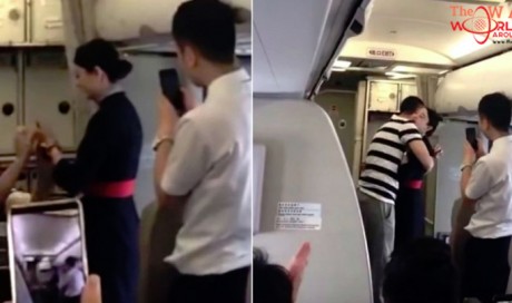 Flight attendant fired for accepting mid-air marriage proposal : Video