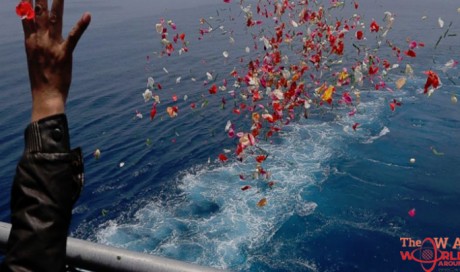 Relatives of Lion Air victims pray, cast flowers into sea