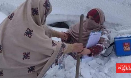 Photos: Pakistani female polio workers battle heavy snow during campaign