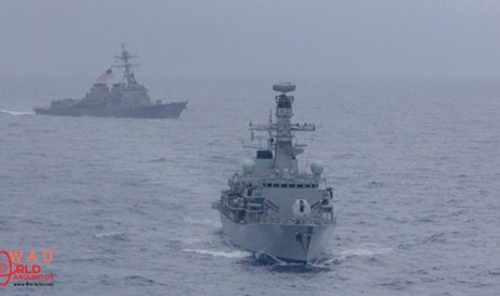 US warships sail through disputed South China Sea as Trump prompts trade war escalation with Beijing