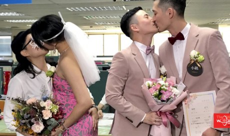 Hundreds of couples tie the knot on the first day of legal same-sex marriage in Taiwan