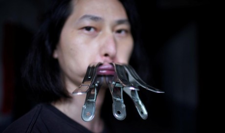 Chinese artist holds his tongue in protest of pandemic censorship